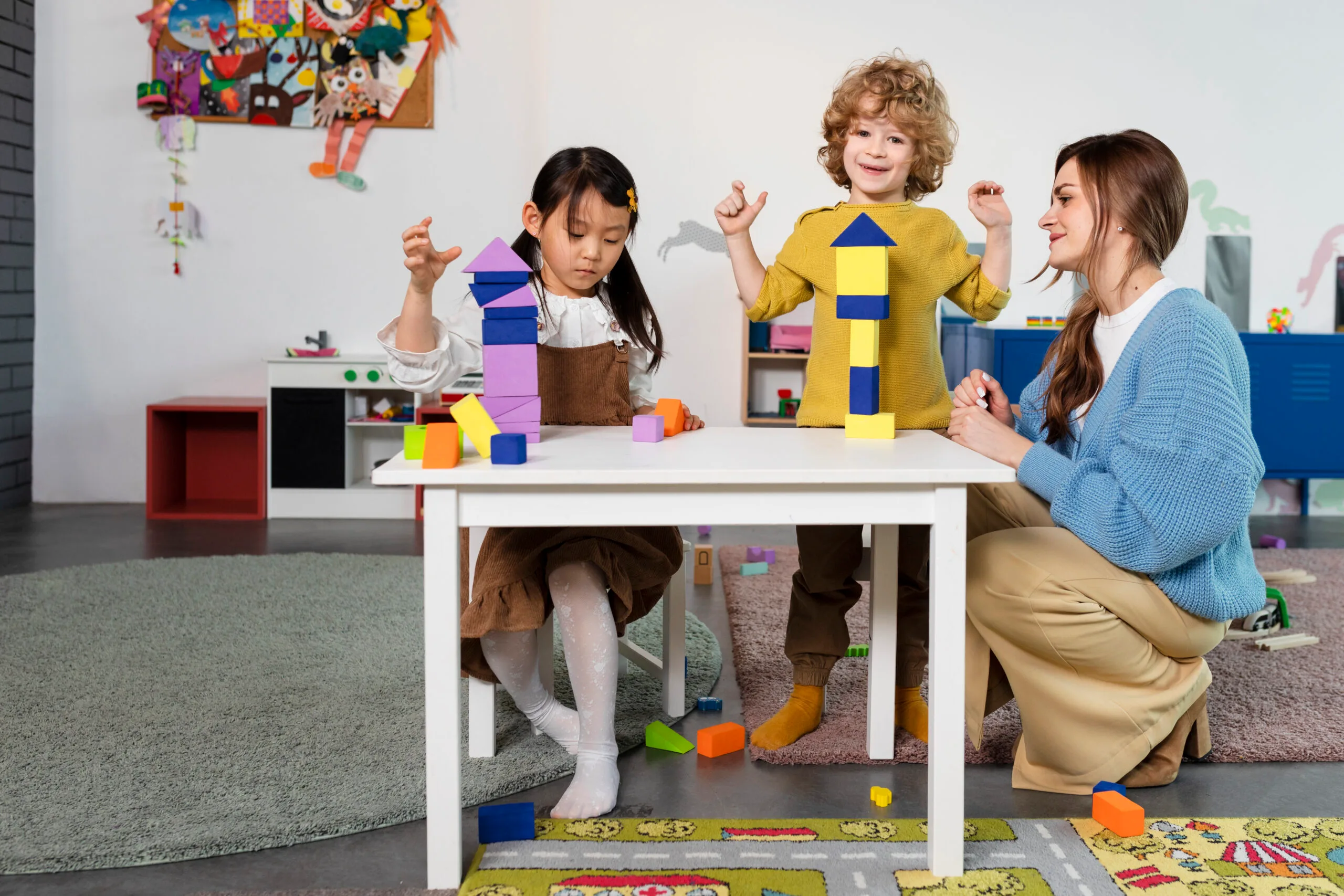 full-shot-kids-playing-with-wooden-shapes-scaled.jpg